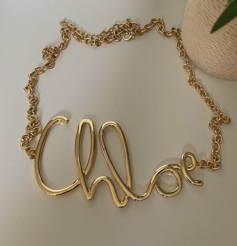 Ceinture chaîne dorée motif love